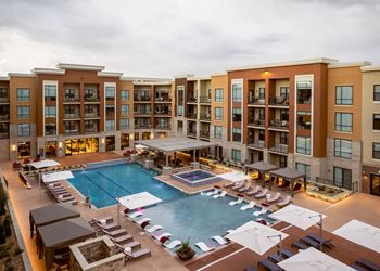 Massive Swimming Pool with submersed sun loungers at The Residences at Galleria, Overland Park, KS